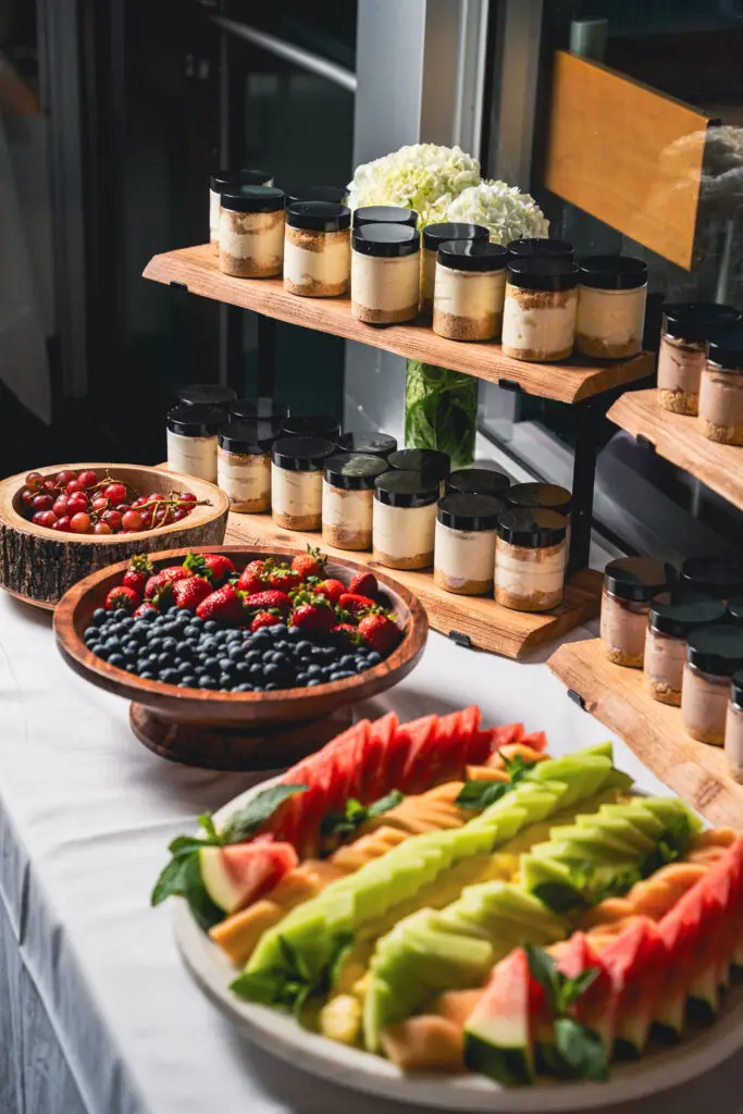 Fresh fruit platter and dessert jars from Grand Cafe catering