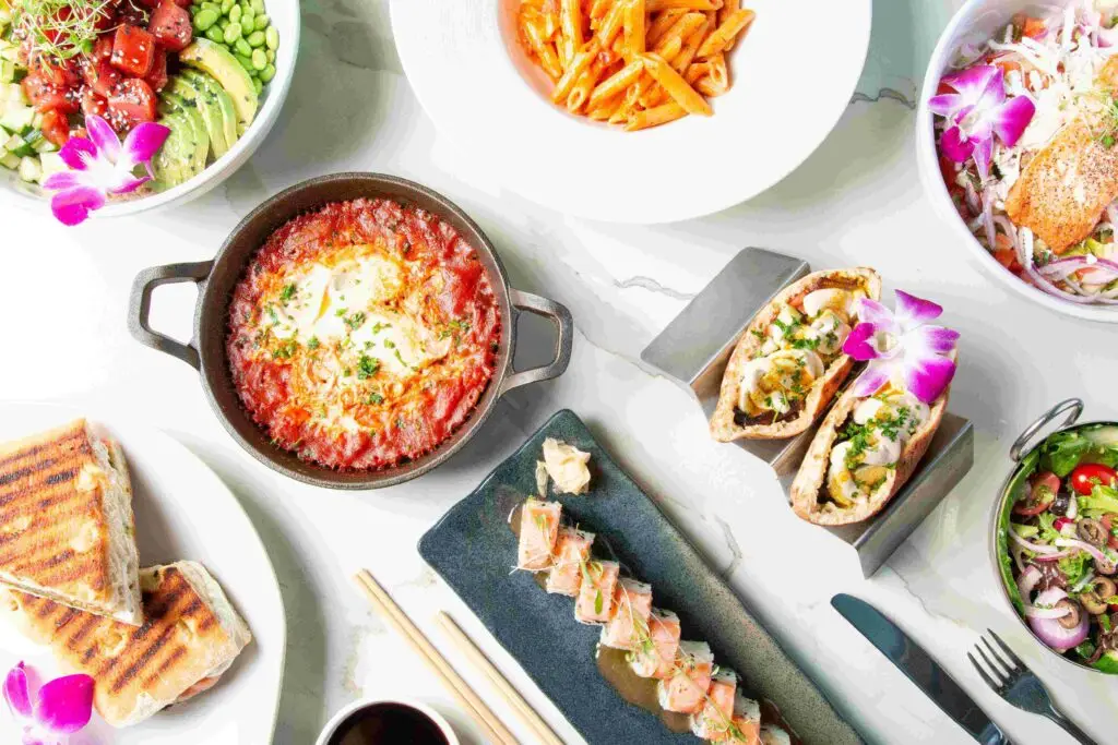 Kosher dishes at Grand Cafe: shakshuka, sushi roll, poke bowl, pasta, pita and salads