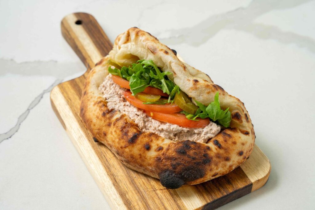 Grand Cafe catering sandwich on a wooden board